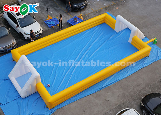 Giant Inflatable Football 12 * 6m สีเหลือง PVC เกมกีฬาทำให้พองสนามฟุตบอลทำให้พอง